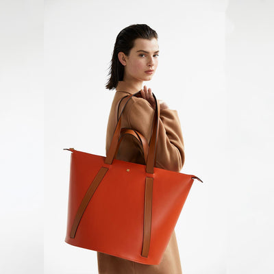 hermes orange oversized travel bag #color_camel-orange